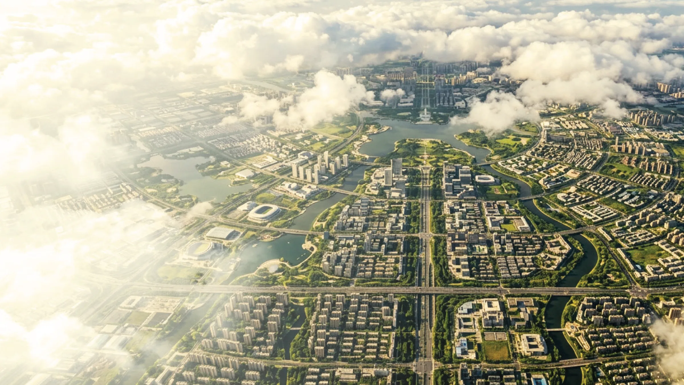 Aerial view of a planned green city among the clouds